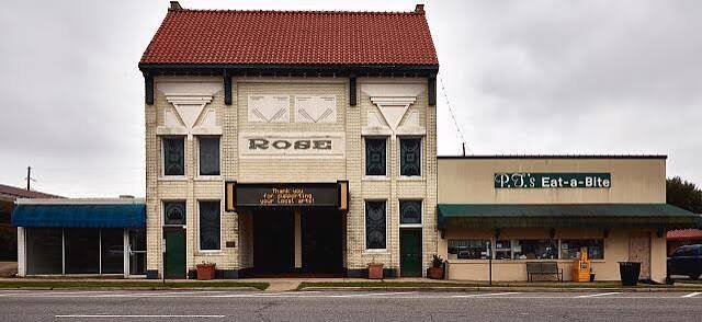 The Rose Theatre and PT's Eat-a-Bite side by side on Courthouse Square in Bastrop